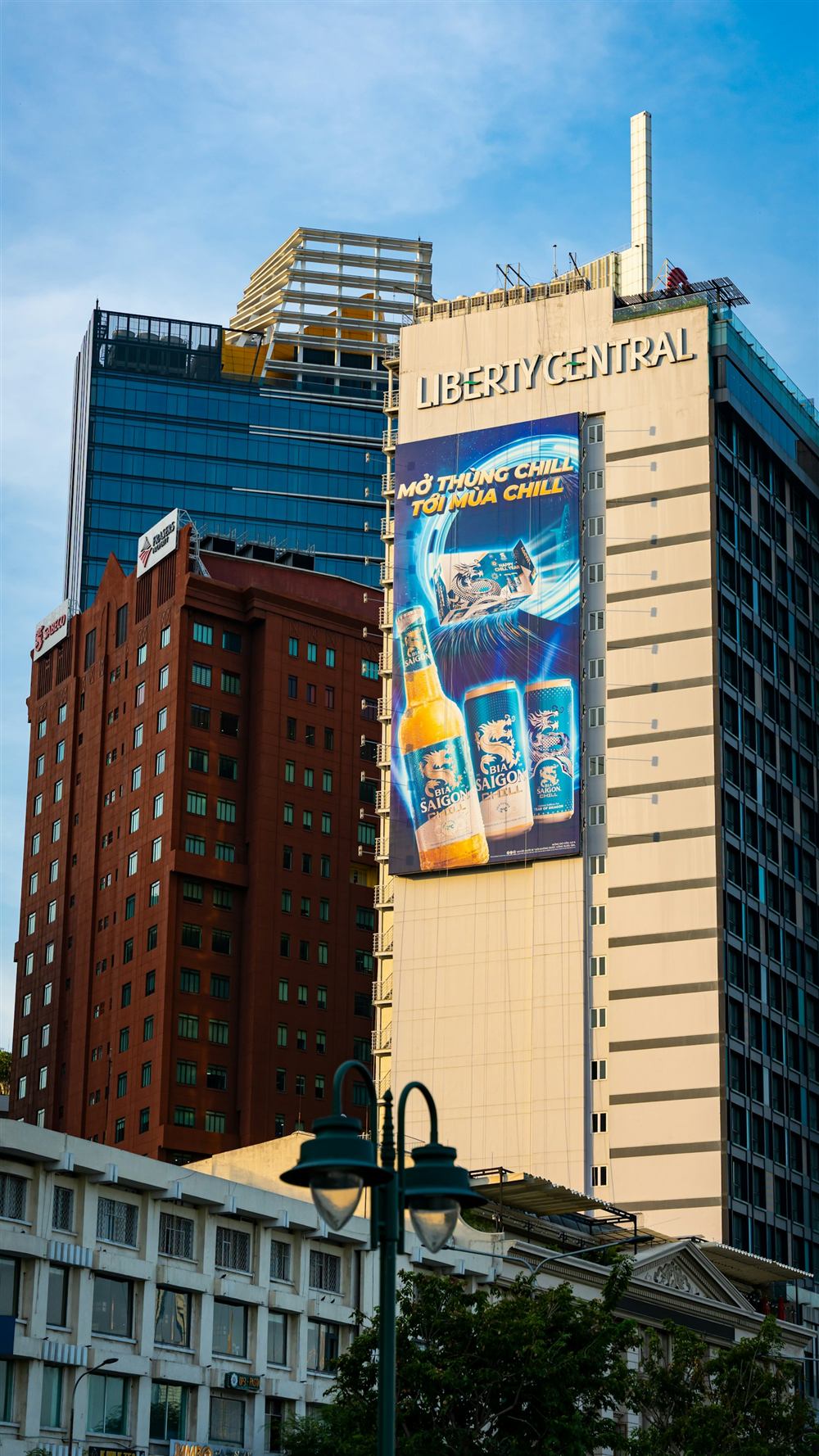 Large building-mounted advertisement covering the side of a high-rise tower